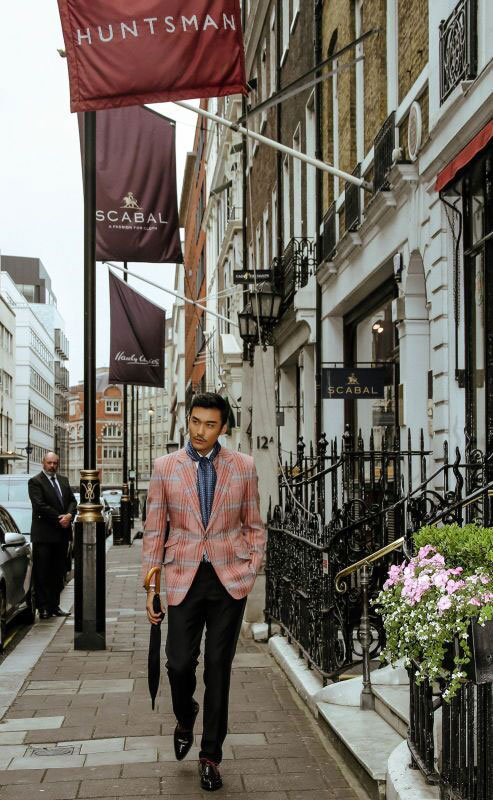 Hu Bing wearing Huntsman in Savile Row at London Collections Men on The Man Has Style