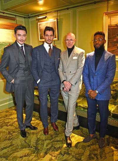 Hu Bing in his Huntsman bespoke three piece suit at London Collections Men