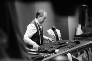 Senior cutter at Huntsman, Robert Bailey works on a bespoke three piece suit for Hu Bing
